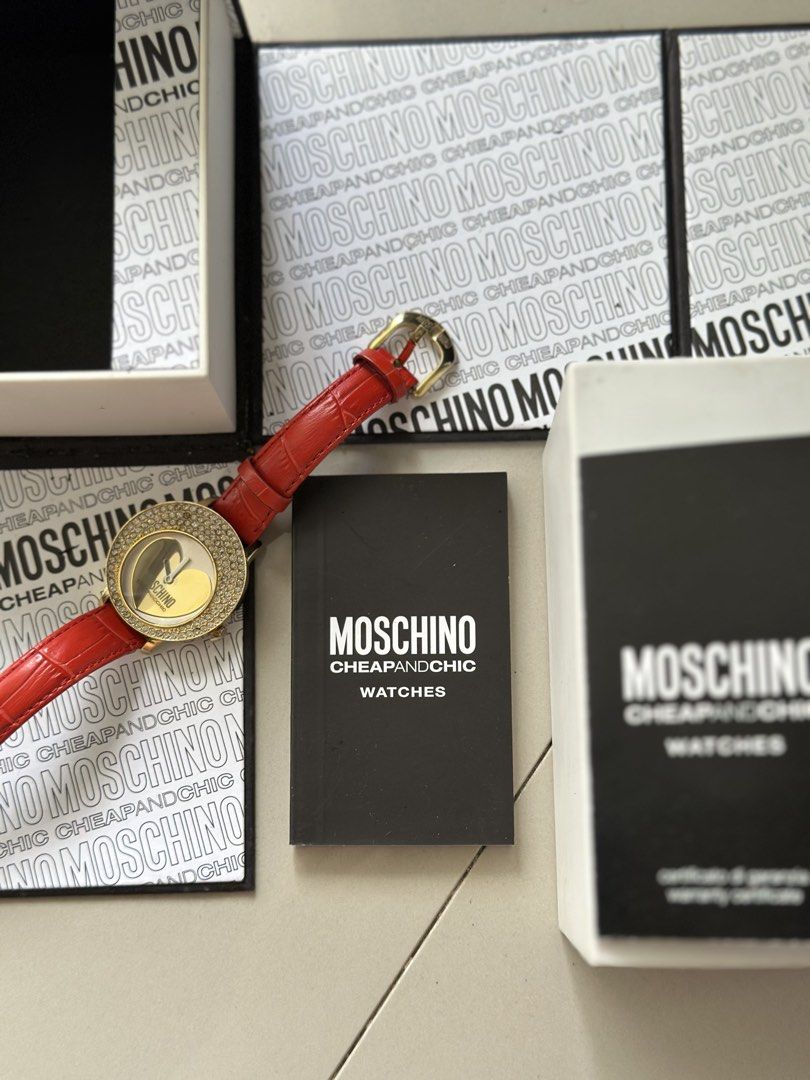 Moschino Cheap and Chic Analog Wristwatch (Category: Women's Watches) located in Pasig City. Submitted by claysome (Listing ID 1466993503, Image 1). Description: -Original Red Strap -Comes with Original Box -Gold-tone Bezel Set with Rhinestones -10/10.