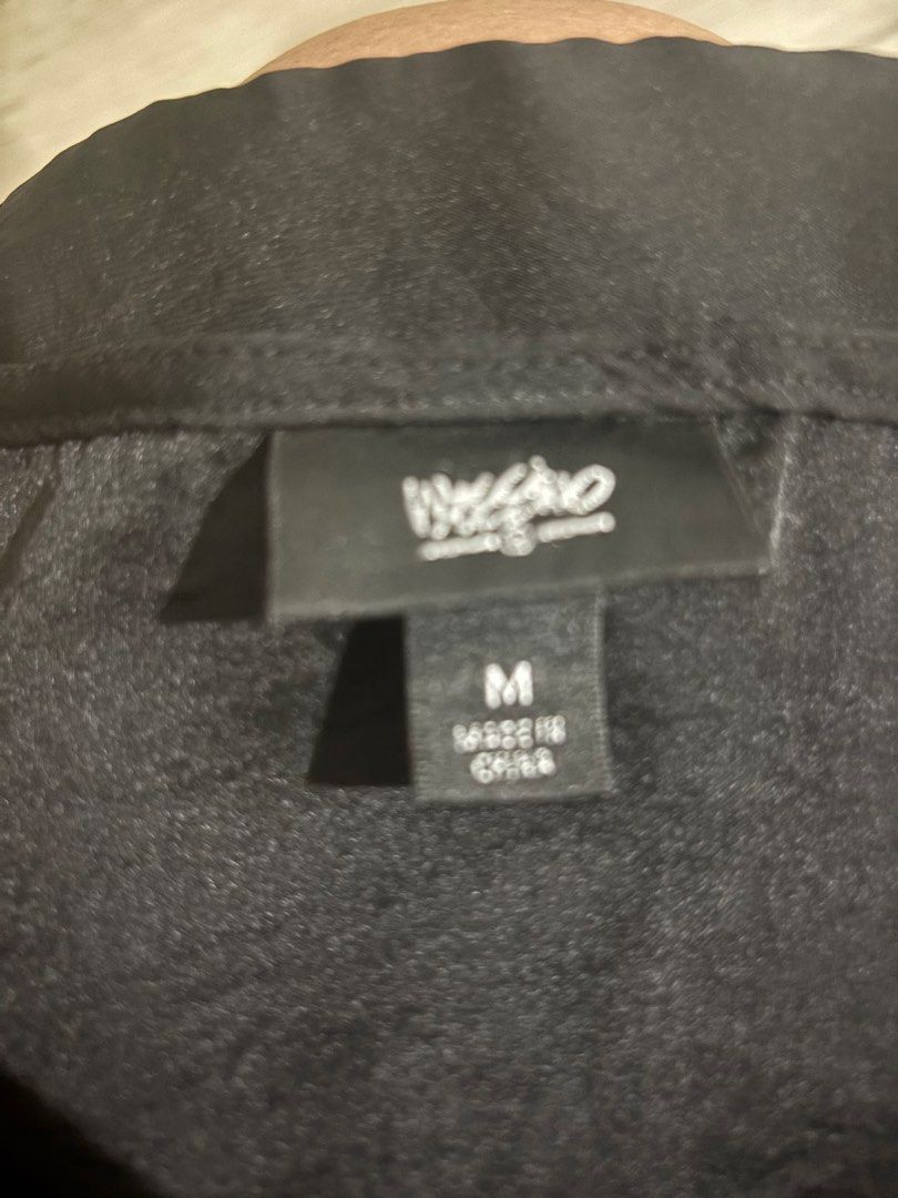 Mossimo Black short sleeve blouse (Category: Blouses) located in Cavite. Submitted by tetpangan (Listing ID 1467134862, Image 2). Description: -preloved Mossimo top - Color: Classic black - Style: Relaxed fit short-sleeve blouse - Neckline: Scoop neck - Details: Rolled cuffs and layered pleated bottom hem - Fabric: Lightweight and slightly sheer - Versatility: Easy to style with jeans or skirts for casual daily wear.