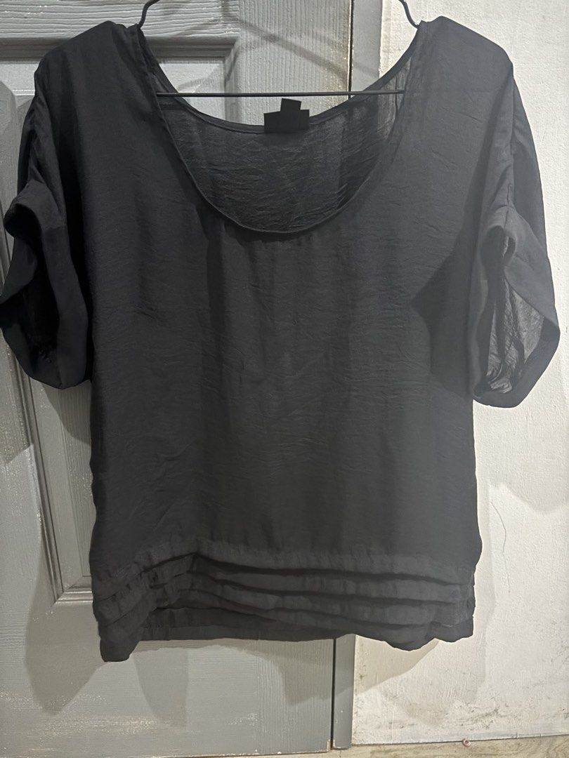Mossimo Black short sleeve blouse (Category: Blouses) located in Cavite. Submitted by tetpangan (Listing ID 1467134862, Image 1). Description: -preloved Mossimo top - Color: Classic black - Style: Relaxed fit short-sleeve blouse - Neckline: Scoop neck - Details: Rolled cuffs and layered pleated bottom hem - Fabric: Lightweight and slightly sheer - Versatility: Easy to style with jeans or skirts for casual daily wear.