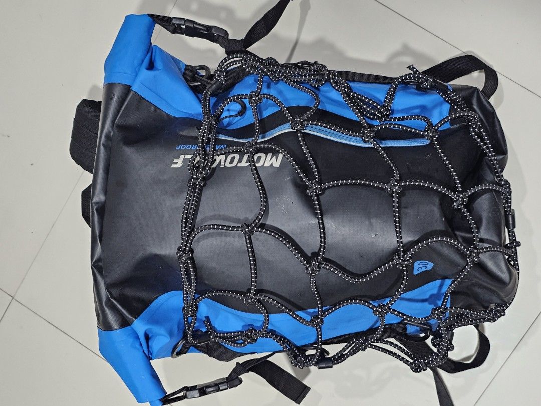 Motowolf Waterproof Motorcycle Backpack Roll-Top Bag (Category: Backpacks) located in Las Pinas. Submitted by 3xplor3r (Listing ID 1467156442, Image 1). Description: - Brand/Model: Motowolf Waterproof Roll-Top Motorcycle Backpack - Color: Black and Blue - Material: Durable synthetic built for wet weather riding - Storage: Convenient outer bungee cargo net for extra gear - Comfort & Safety: Adjustable padded shoulder straps with high-visibility re