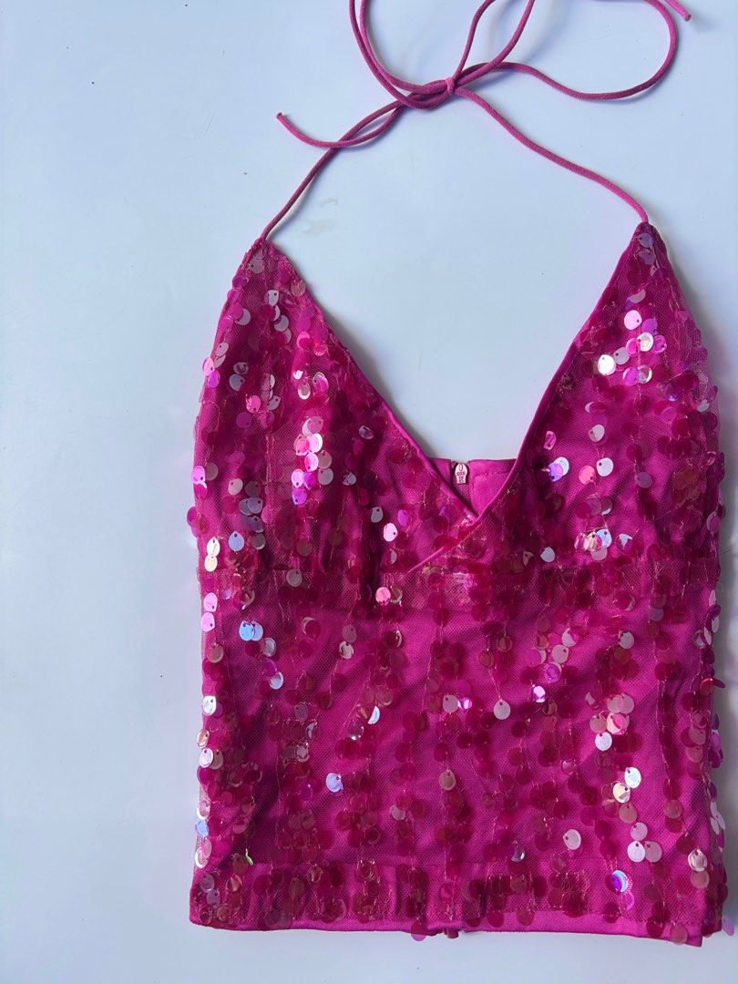 MUSERA Pink Sequin Halter Top Size S (Category: Sleeveless) located in Batac City. Submitted by doniagel (Listing ID 1467125072, Image 2). Description: - Brand: Musera - Size: Small - Color: Bright pink - Material: Sequin with mesh overlay and full lining - Details: Adjustable halter tie straps, low V-cut front, cropped fit with back zipper .