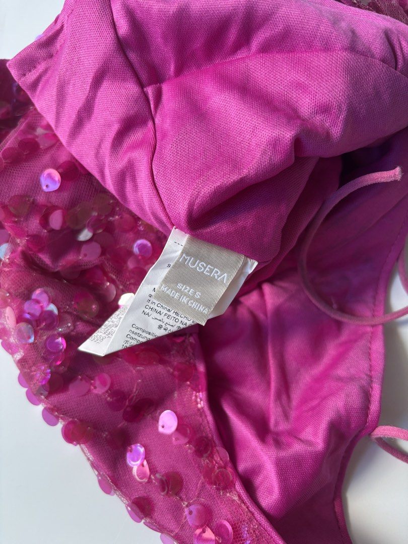 MUSERA Pink Sequin Halter Top Size S (Category: Sleeveless) located in Batac City. Submitted by doniagel (Listing ID 1467125072, Image 3). Description: - Brand: Musera - Size: Small - Color: Bright pink - Material: Sequin with mesh overlay and full lining - Details: Adjustable halter tie straps, low V-cut front, cropped fit with back zipper .