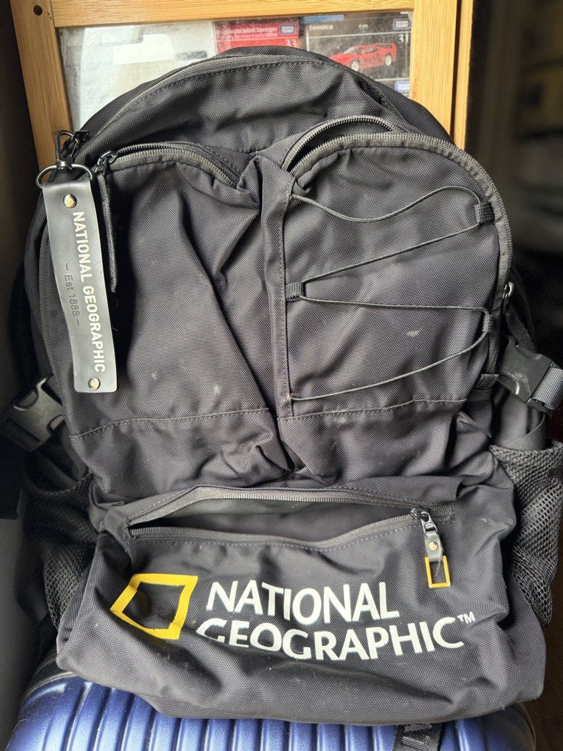 National Geographic Utility Backpack Black (Category: Backpacks) located in Dasmarinas. Submitted by mspigrabbit (Listing ID 1467034472, Image 2). Description: - Brand: National Geographic - Color: Classic Black - Material: Durable, high-quality fabric construction - Storage: Spacious main compartment with an internal padded laptop sleeve and branded label patch - Pockets: Multiple exterior zip pockets and convenient mesh side pockets - Extras: F