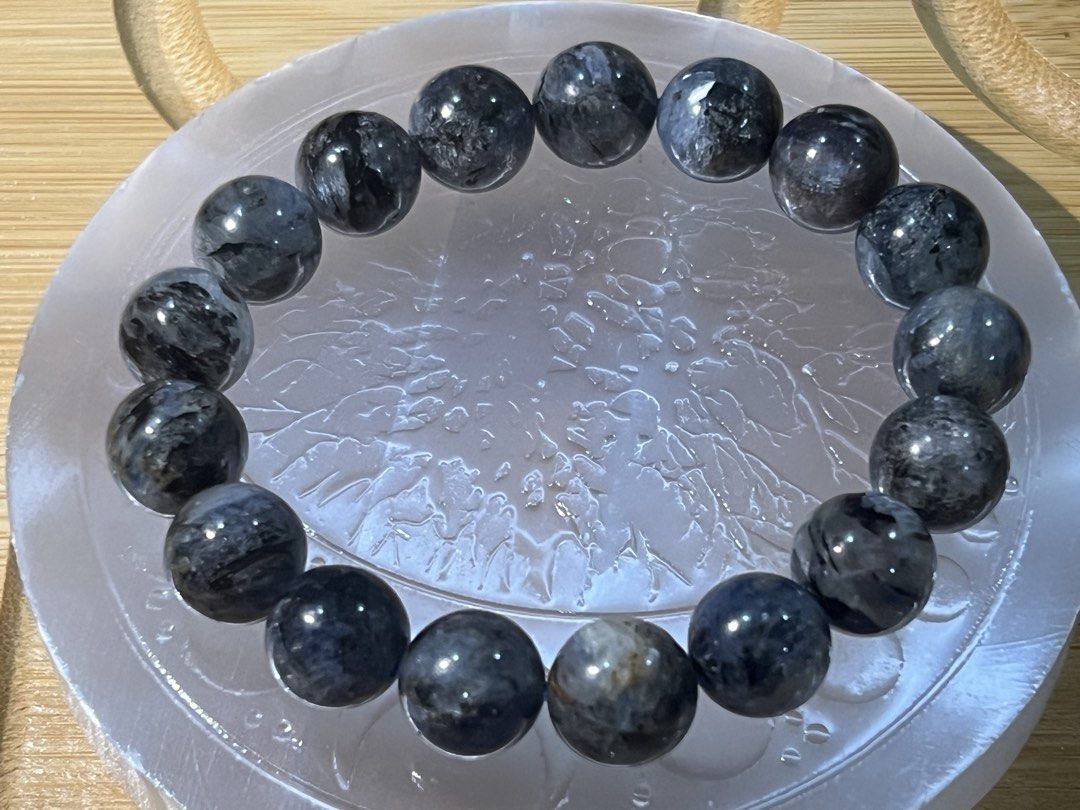 Natural Devil Kyanite Gemstone beaded bracelet 17cm (Category: Bracelets) located in Quezon City. Submitted by ohmystones_088 (Listing ID 1467164814, Image 3). Description: - Dark blue and black patterned crystal beads - Measures 17cm around on a stretch cord - Smooth polished surface with natural inclusions and chatoyant flashes - Nice, substantial weight - Perfect to wear alone or stack with other pieces 100% Authentic / Natural Gemstones Bead 