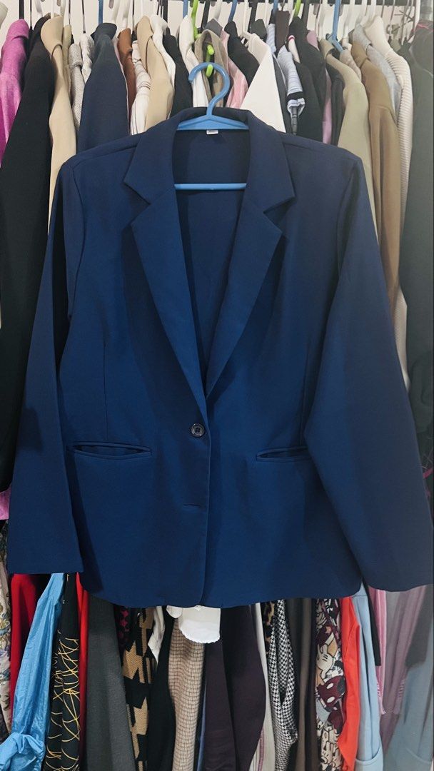 Navy Blue Blazer (Category: Coats, Jackets and Outerwear) located in Quezon City. Submitted by kishey (Listing ID 1467138776, Image 2). Description: - Color: Navy blue - Closure: Single front button with functional front pockets - Fit: Relaxed style, true to size (27" length, 40" circumference) - Style: Clean, tailored look ideal for work or casual layering - Condition: Excellent, easy to throw on over any basic top No inner lining.