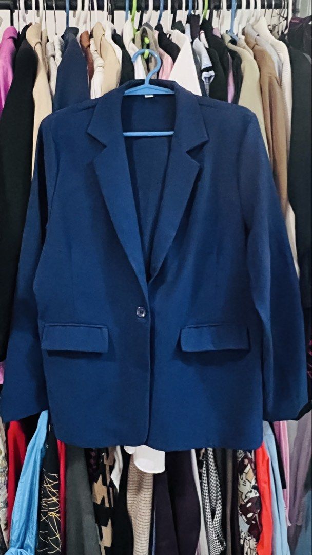 Navy Blue Blazer (Category: Coats, Jackets and Outerwear) located in Quezon City. Submitted by kishey (Listing ID 1467138776, Image 3). Description: - Color: Navy blue - Closure: Single front button with functional front pockets - Fit: Relaxed style, true to size (27" length, 40" circumference) - Style: Clean, tailored look ideal for work or casual layering - Condition: Excellent, easy to throw on over any basic top No inner lining.