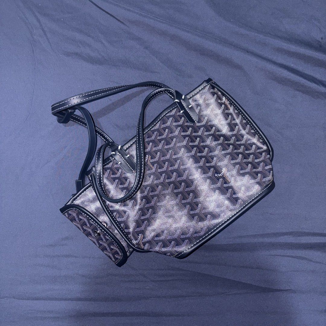 Navy Tote Bag With Attached Pouch (Category: Luxury Bags & Wallets) located in Manila. Submitted by mixofsunshine_ (Listing ID 1467017701, Image 2). Description: - Color: Navy blue with signature chevron print pattern - Handles: Dual straps featuring white contrast stitching - Condition: Excellent, well-maintained - Mode of Payment: GCash, MAYA, or Bank Transfer - Shipping: Via LALAMOVE or same-day delivery within Metro Manila (buyer shoulders sh