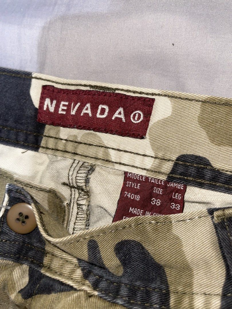 Nevada Camouflage Cargo Pants Size 38x33 (Category: Jeans) located in Cebu City. Submitted by meemaoo (Listing ID 1467147840, Image 3). Description: - Brand: Nevada - Size: Waist 38, Leg Length 33 - Material: 100% thick cotton canvas - Features: Multiple utility pockets, button closure, and belt loops - Condition: Great streetwear piece, sturdy and durable fabric -SF FEE SHOULDERED BY BUYER .
