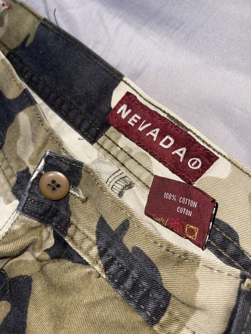 Nevada Camouflage Cargo Pants Size 38x33 (Category: Jeans) located in Cebu City. Submitted by meemaoo (Listing ID 1467147840, Image 2). Description: - Brand: Nevada - Size: Waist 38, Leg Length 33 - Material: 100% thick cotton canvas - Features: Multiple utility pockets, button closure, and belt loops - Condition: Great streetwear piece, sturdy and durable fabric -SF FEE SHOULDERED BY BUYER .