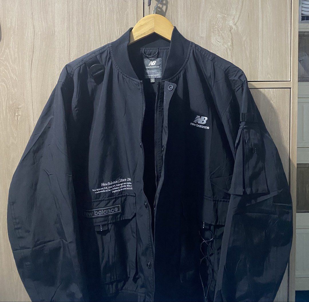 New Balance Windproof Bomber Jacket (Category: Coats, Jackets and Outerwear) located in Binan City. Submitted by rnj_affordable (Listing ID 1466988559, Image 3). Description: Ganda ng tela parang water proof super bigat madaming pocket meron sa front and sleeves pocket may botones may zipper narin kulang lang isang micro snap.
