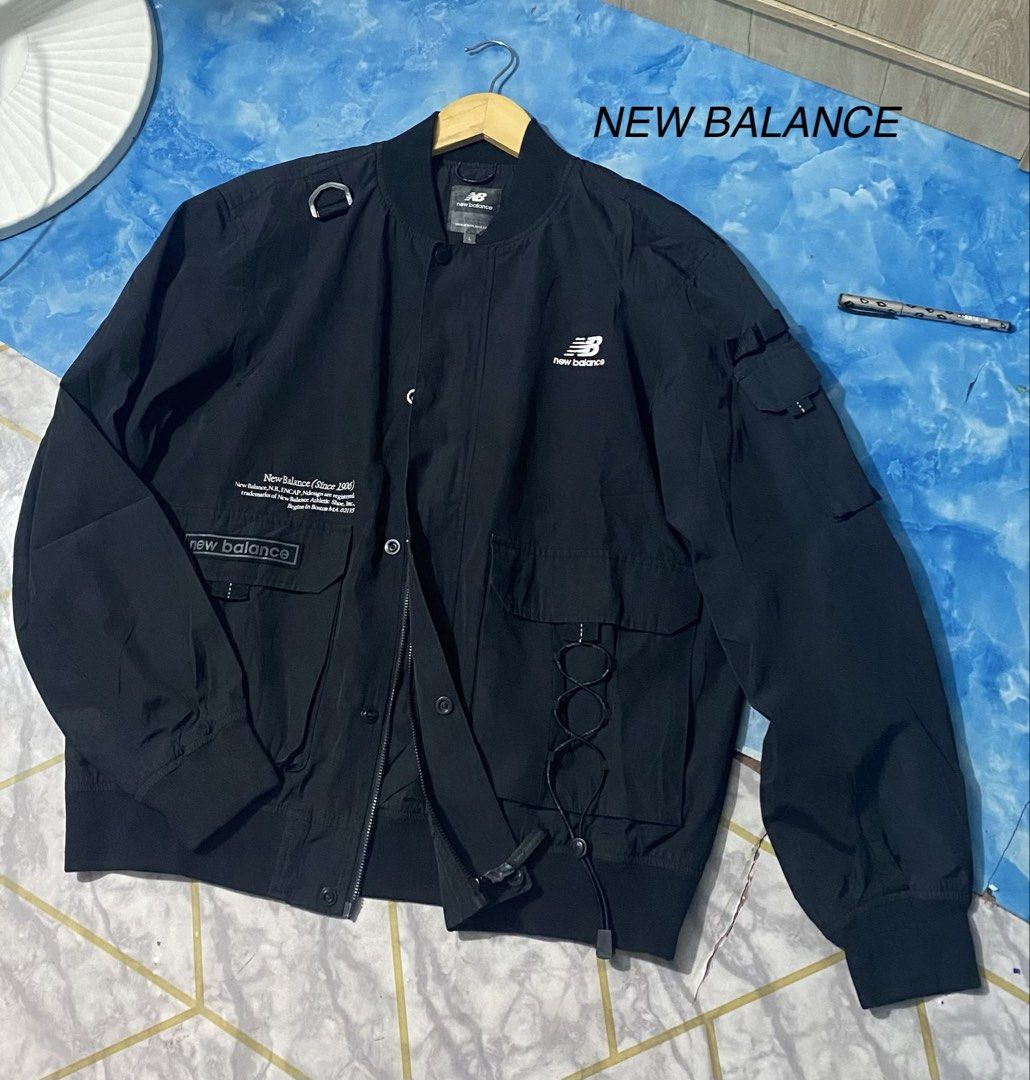 New Balance Windproof Bomber Jacket (Category: Coats, Jackets and Outerwear) located in Binan City. Submitted by rnj_affordable (Listing ID 1466988559, Image 2). Description: Ganda ng tela parang water proof super bigat madaming pocket meron sa front and sleeves pocket may botones may zipper narin kulang lang isang micro snap.