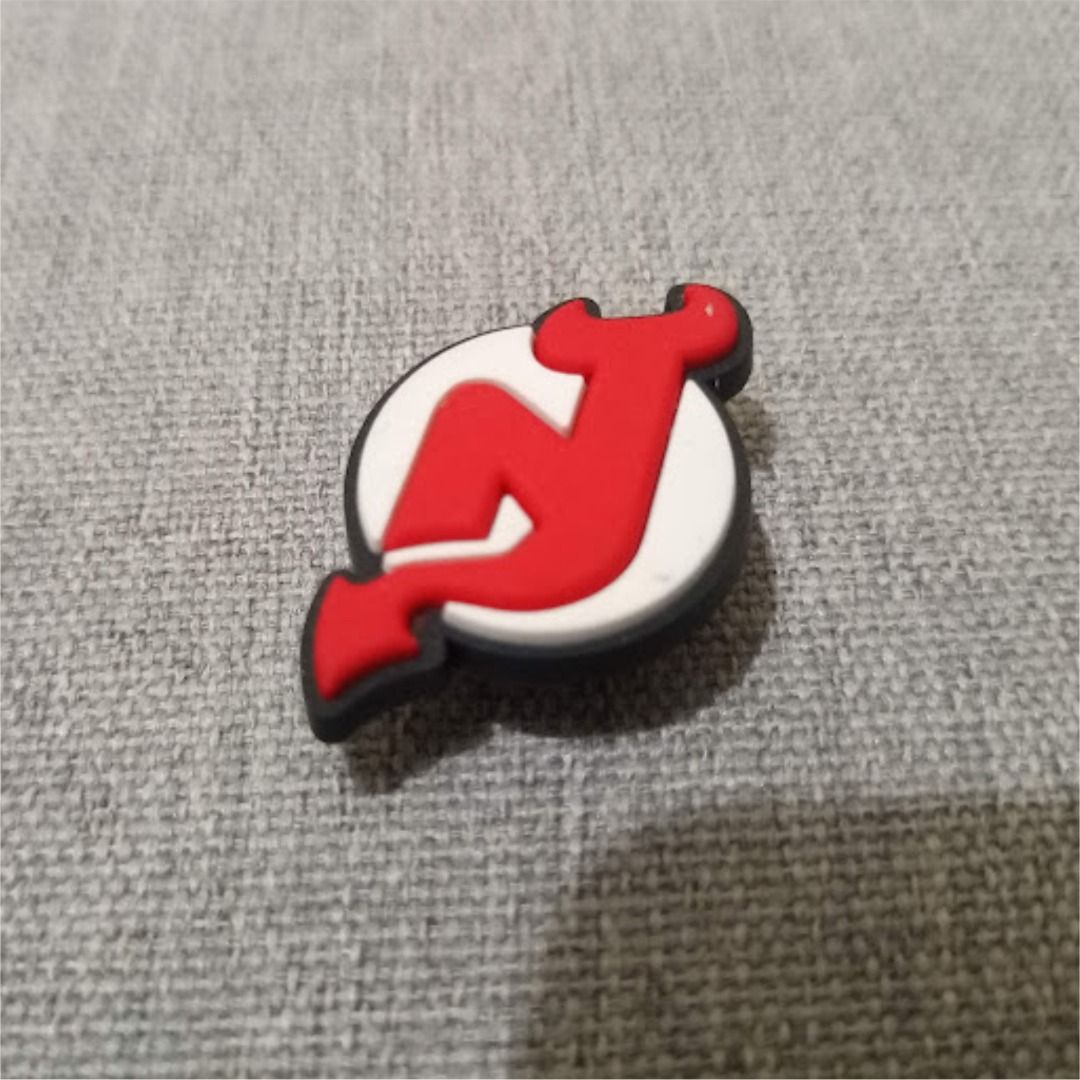 New Jersey Devils Crocs Jibbitz Shoe Charm (Category: Flats & Sandals) located in Quezon City. Submitted by susmaryosep1 (Listing ID 1467018930, Image 2). Description: - Design: Official New Jersey Devils red and white team logo - Compatibility: Fits all standard shoe ventilation holes (great for clogs and sandals) - Material: Durable, high-quality rubber - Use: Perfect for customizing footwear and showing your hockey support - Condition: Brand n