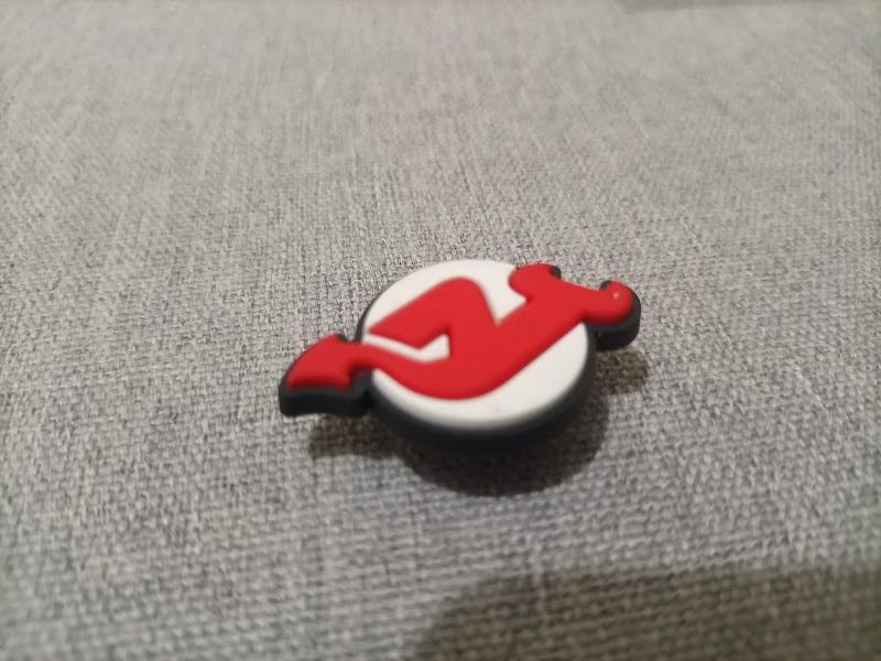 New Jersey Devils Crocs Jibbitz Shoe Charm (Category: Flats & Sandals) located in Quezon City. Submitted by susmaryosep1 (Listing ID 1467018930, Image 3). Description: - Design: Official New Jersey Devils red and white team logo - Compatibility: Fits all standard shoe ventilation holes (great for clogs and sandals) - Material: Durable, high-quality rubber - Use: Perfect for customizing footwear and showing your hockey support - Condition: Brand n