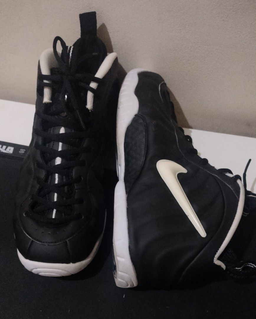 Nike Air Foamposite Pro Black White (Category: Sneakers) located in Caloocan City. Submitted by amzki15 (Listing ID 1467027875, Image 2). Description: - Brand/Model: Nike Foamposite Pro - Colorway: Classic Black and White - Condition: Good overall condition with minimal toe box creases and solid grip on soles - Features: Molded foam shell upper, contrasting white swoosh, pull loops on tongue and heel, and striped black laces - Versatility: Ideal 