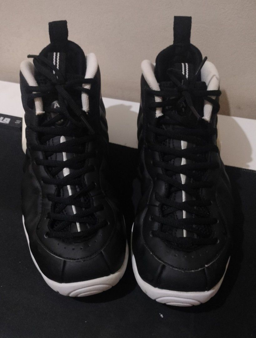 Nike Air Foamposite Pro Black White (Category: Sneakers) located in Caloocan City. Submitted by amzki15 (Listing ID 1467027875, Image 3). Description: - Brand/Model: Nike Foamposite Pro - Colorway: Classic Black and White - Condition: Good overall condition with minimal toe box creases and solid grip on soles - Features: Molded foam shell upper, contrasting white swoosh, pull loops on tongue and heel, and striped black laces - Versatility: Ideal 