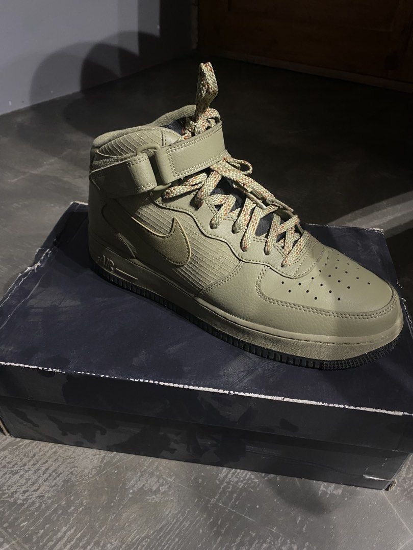 Nike Air Force 1 Mid '07 Neutral Olive (Category: Sneakers) located in Imus. Submitted by joaquinduq01043 (Listing ID 1467143975, Image 2). Description: - Brand: Nike Air Force 1 Mid '07 - Colorway: Neutral Olive - Size: US Men's 11 / US Women's 12.5 - Materials: Rugged canvas panels mixed with leather overlays - Features: Distinct speckled rope laces and secure velcro ankle strap - Inclusions: Complete with original box -slightly visible crease,