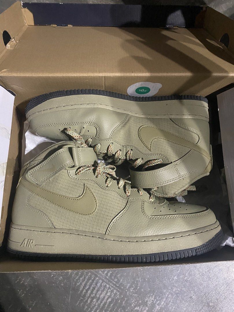 Nike Air Force 1 Mid '07 Neutral Olive (Category: Sneakers) located in Imus. Submitted by joaquinduq01043 (Listing ID 1467143975, Image 1). Description: - Brand: Nike Air Force 1 Mid '07 - Colorway: Neutral Olive - Size: US Men's 11 / US Women's 12.5 - Materials: Rugged canvas panels mixed with leather overlays - Features: Distinct speckled rope laces and secure velcro ankle strap - Inclusions: Complete with original box -slightly visible crease,