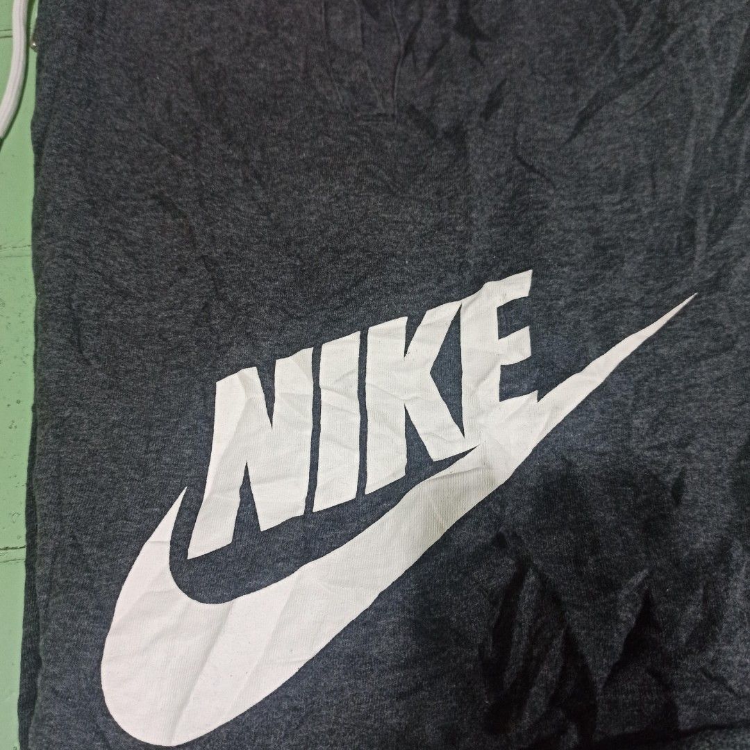 Nike Alumni (Category: Shorts) located in Tagbilaran City. Submitted by delasierra39181 (Listing ID 1467078532, Image 2). Description: - Brand: Nike - Color: Dark grey with large white swoosh logo - Size: XL (Recommended for height 175-185 cm) - Material: 100% cotton for ultimate comfort - Details: White drawstring waist with metal aglets - Origin: Made in China.