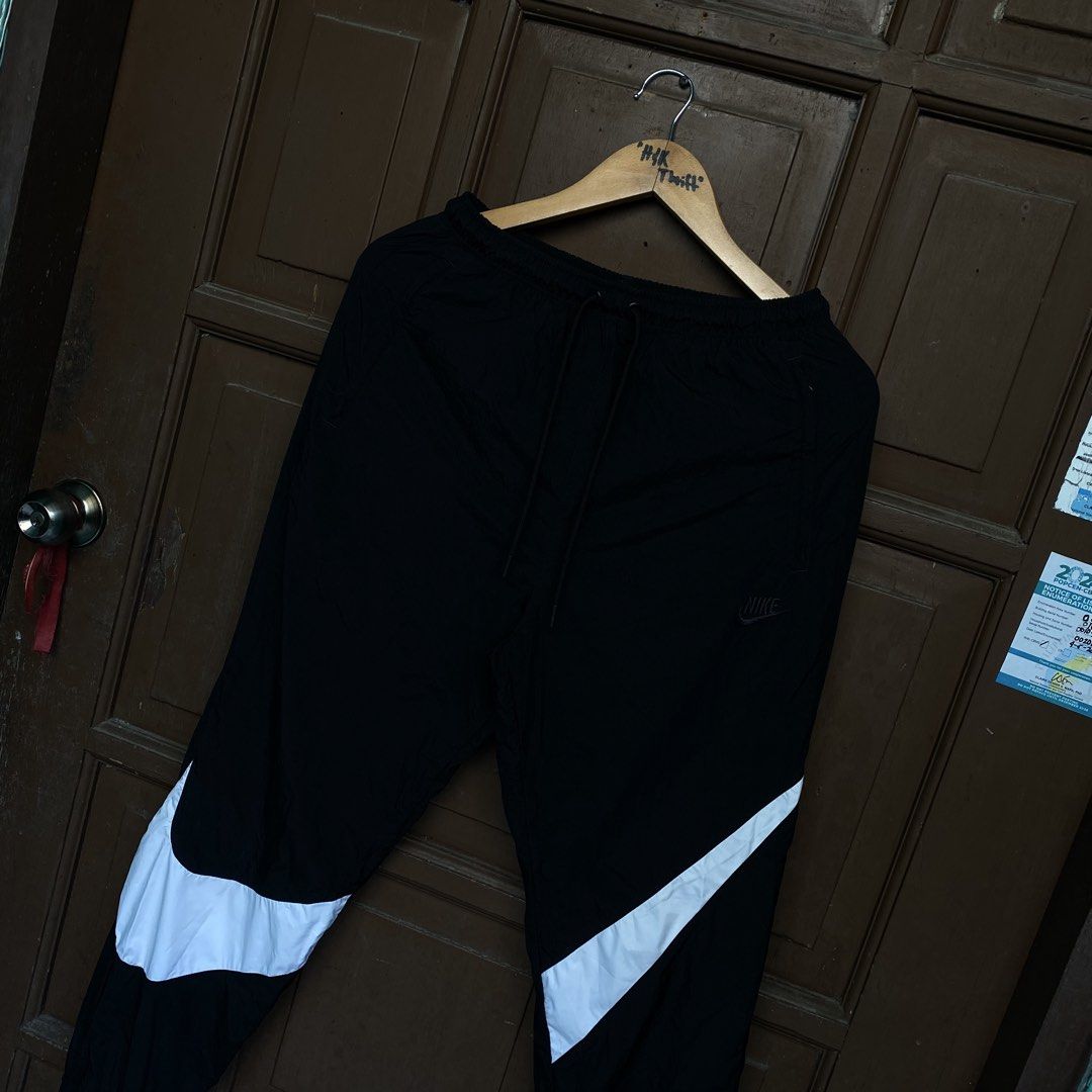 Nike Big Swoosh Woven Pants 🥵 (Category: Activewear) located in Consolacion. Submitted by kentripthrift (Listing ID 1467093614, Image 2). Description: Nike Big Swoosh Woven Pants 🥵 My Fav / Crispy Condition / Hard to find Design & Latest Tag 😍 Good As New Condition Color rate: 10/10 Color may vary due to lighting Size: Small on tag Dimes: 28-32W by 38L.