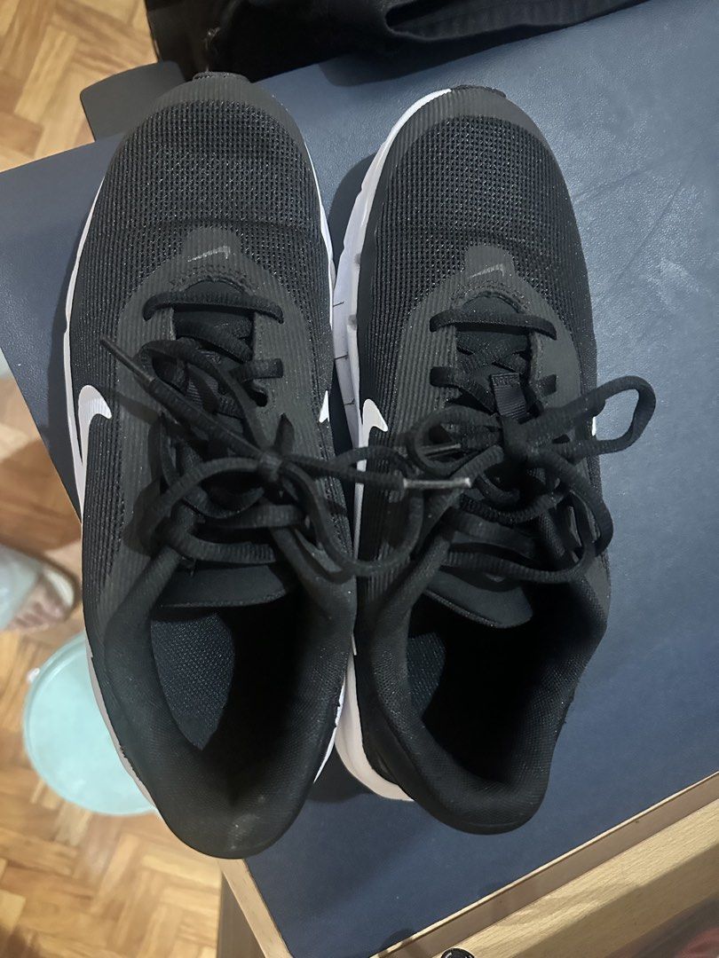 Nike Black and White Running Shoes (Category: Sneakers) located in Manila. Submitted by hillaryuy (Listing ID 1466974161, Image 1). Description: - Brand: Nike - Color: Black with white soles and classic white swoosh - Material: Breathable mesh upper for all-day comfort - Details: Clean black laces included - Condition: Excellent, hardly worn and very clean.