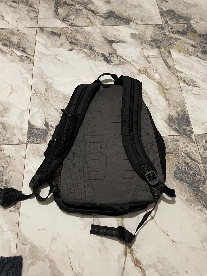 Nike Black Backpack with Multiple Compartments (Category: Backpacks) located in Manila. Submitted by mikeee03 (Listing ID 1467063271, Image 3). Description: - Authentic black Nike backpack with white swoosh logo - Multiple zippered compartments for easy organization - Convenient extra zippered pocket on the shoulder strap - Side mesh pockets for water bottles and small essentials - Padded back panel for all-day comfort and support - Durable build