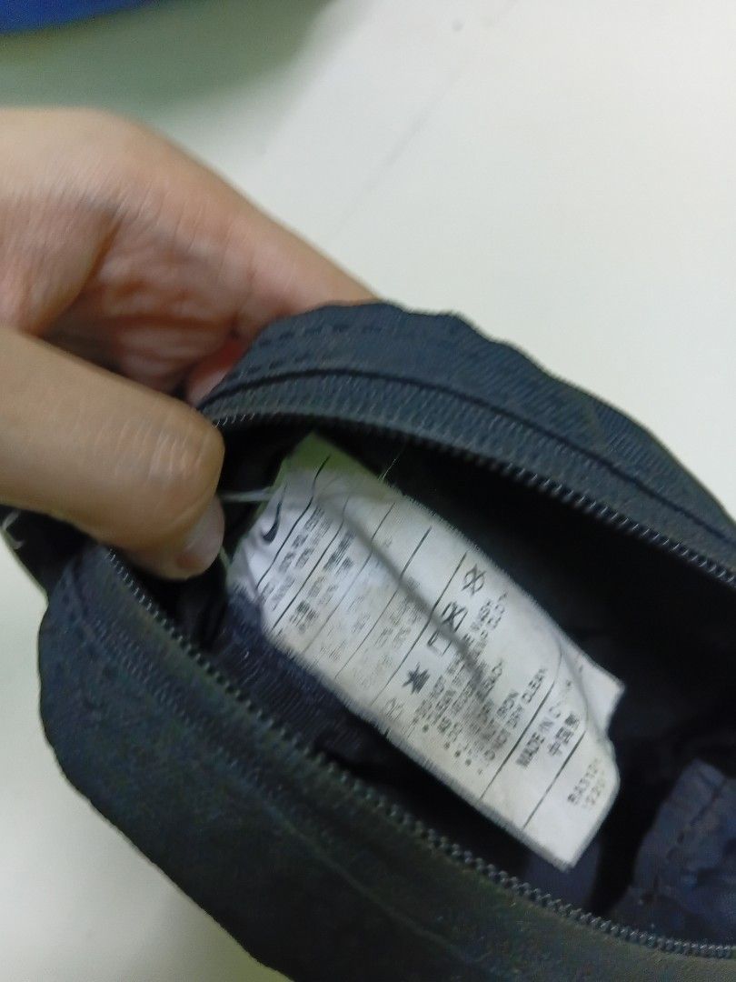Nike black crossbody bag (Category: Sling Bags) located in Manila. Submitted by daphnefinds1 (Listing ID 1467102934, Image 3). Description: - Brand: Nike - Color: Classic Black - Style: Compact crossbody bag with adjustable strap - Storage: Front zippered pocket + main compartment for phone, wallet, and keys - Condition: Excellent / Handy everyday use - Origin: Made in China (with care tag intact).