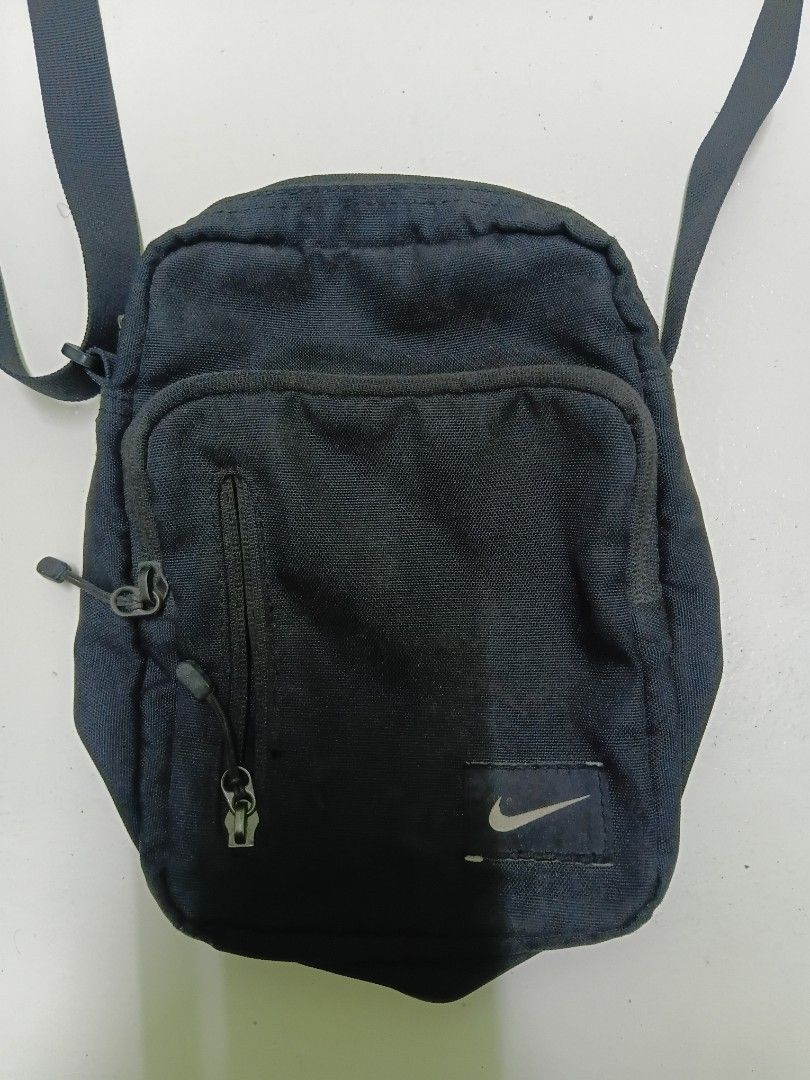 Nike black crossbody bag (Category: Sling Bags) located in Manila. Submitted by daphnefinds1 (Listing ID 1467102934, Image 2). Description: - Brand: Nike - Color: Classic Black - Style: Compact crossbody bag with adjustable strap - Storage: Front zippered pocket + main compartment for phone, wallet, and keys - Condition: Excellent / Handy everyday use - Origin: Made in China (with care tag intact).