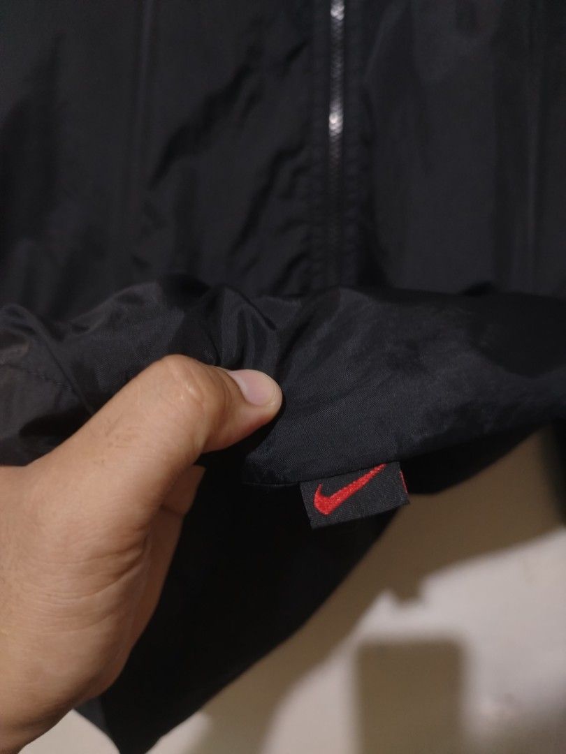 Nike Black Windbreaker Jacket packable hood (Category: Coats, Jackets and Outerwear) located in Rizal. Submitted by gmpastoffi75031 (Listing ID 1467018901, Image 3). Description: - Brand: Nike - dimes 23.8x29.5 - Style: Windbreaker jacket - Color: Black - Size: XL - Origin: Made in Indonesia - Material: Lightweight Dri-FIT fabric, perfect for layering - Details: Full zip front with metallic Nike logo pull, embroidered white swoosh on chest, and s