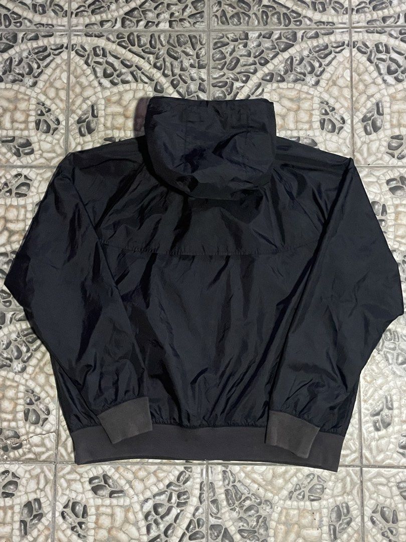 Nike Black Windbreaker Jacket with Hood (Category: Coats, Jackets and Outerwear) located in Cavite. Submitted by inzu_ (Listing ID 1467025298, Image 2). Description: - Authentic black Nike windbreaker with matching hood and drawstrings - Full zip front featuring a branded zipper pull - Embroidered white Nike logo on the chest - Ribbed cuffs and hem to lock in warmth and block the wind - Lightweight fabric with convenient side pockets - Standard f
