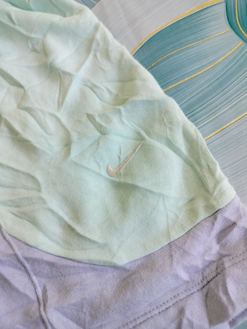 Nike Colourblock Shorts Light Mint Purple Size M (Category: Activewear) located in Manila. Submitted by virgiliosa38485 (Listing ID 1467111687, Image 2). Description: - Brand: Nike -Waist 28-36 -Length 15 -Leg Opening 14 - Colorway: Mint green and light purple colorblock - Size: Medium (tag attached) - Material: Comfortable cotton blend - Design details: Elastic waistband, small embroidered Nike swoosh, and lower hem graphic print ("Be as you are