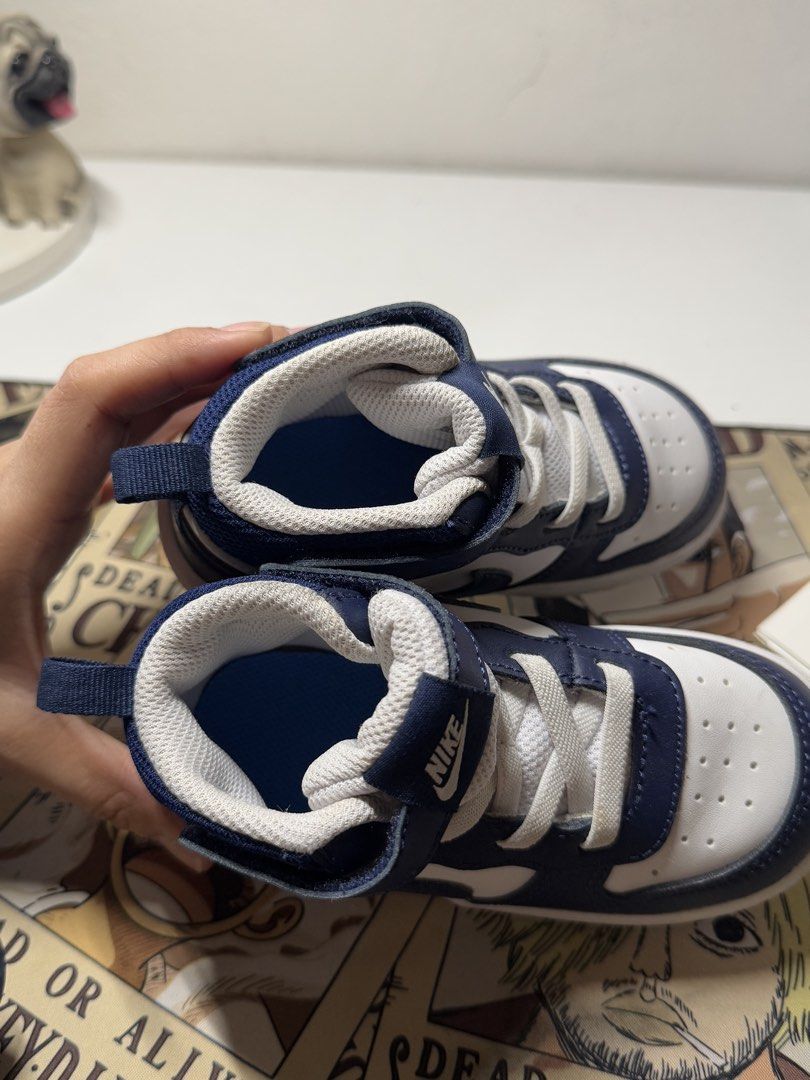 Nike Court Borough Mid 2 (Category: Babies & Kids Fashion) located in Pasig City. Submitted by clarissab._2323 (Listing ID 1467137705, Image 3). Description: - Brand: Nike - Color: Navy and white - Size: 8C toddlers - Closure: Hook and loop strap over laces for a secure fit - Comfort: Padded mesh collar - Sole: Textured rubber outsole with 'All Day Play' lettering - Good as new used once only. - No box ‼️.