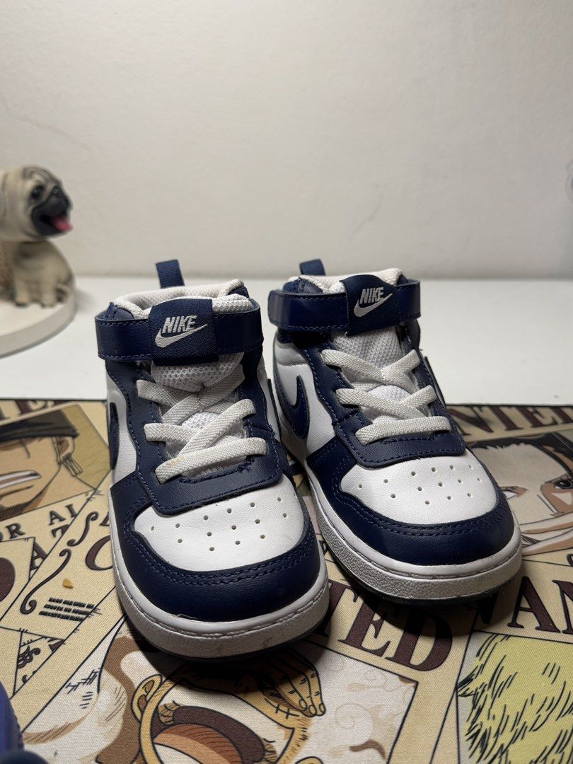 Nike Court Borough Mid 2 (Category: Babies & Kids Fashion) located in Pasig City. Submitted by clarissab._2323 (Listing ID 1467137705, Image 2). Description: - Brand: Nike - Color: Navy and white - Size: 8C toddlers - Closure: Hook and loop strap over laces for a secure fit - Comfort: Padded mesh collar - Sole: Textured rubber outsole with 'All Day Play' lettering - Good as new used once only. - No box ‼️.