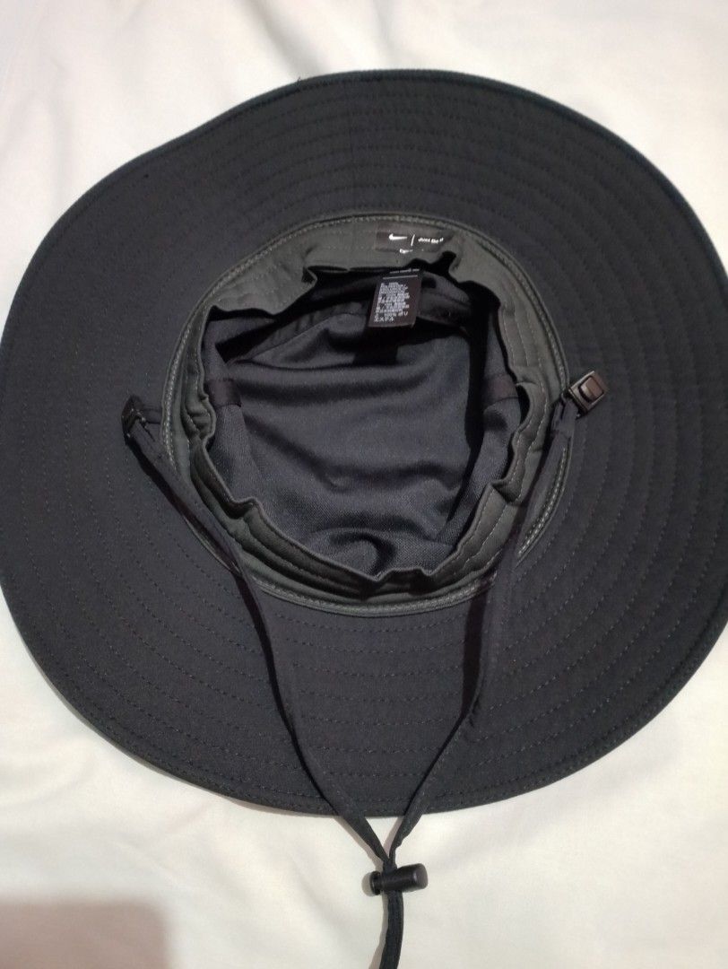Nike Dri-FIT Black Bucket Hat (Category: Caps & Hats) located in Manila. Submitted by nievesolanna (Listing ID 1467009018, Image 2). Description: adjustable and removable chin strap. like new. no issues. used once only. 1,000 PESOS LOC: SAMPALOC, MANILA.