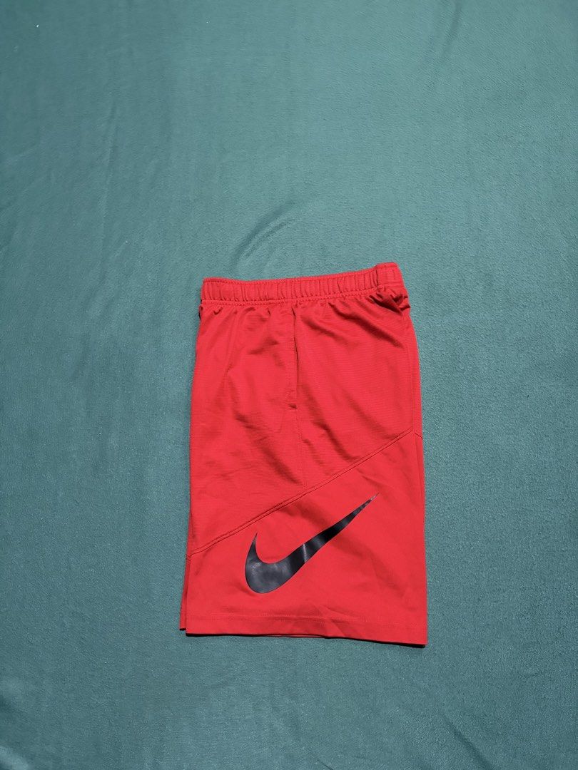 Nike Dri-FIT Red Athletic Shorts Size M (Category: Shorts) located in Guihulngan. Submitted by fbthriftgoodsniace (Listing ID 1467095522, Image 1). Description: - Brand: Nike - Color: Bright red with black Swoosh logo - Size: Medium (M) - Material: Dri-FIT moisture-wicking fabric - Features: Elastic waistband with inner adjustable drawstring - Measurements: ~11.5" flat waist across, ~21" total length - Origin: Made in Thailand - Condition: Excell