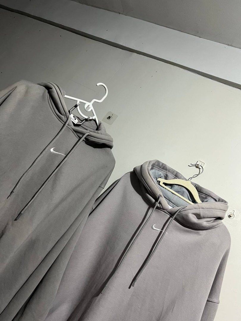 Nike Double Hooded Size M&XL (Category: Hoodies) located in Bacoor. Submitted by theneedwash (Listing ID 1467130571, Image 1). Description: - Brand: Nike - Color: Grey with small embroidered white swoosh - Size: Medium (tag on collar and care label intact) - Material: Clean cotton blend fleece, made in Vietnam - Features: Working drawstrings, ribbed cuffs, and hem - Condition: Excellent layering piece, well-maintained.
