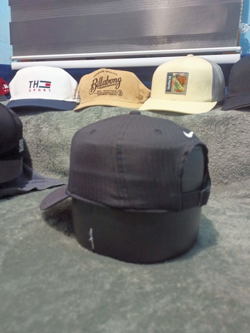 Nike Legacy91 Dri-Fit Black Cap (Category: Caps & Hats) located in Manila. Submitted by thecomftrift.co (Listing ID 1467026077, Image 2). Description: - Brand: Nike Legacy91 - Color: Black with white embroidered swoosh on front and back - Material: 100% polyester with moisture-wicking Dri-Fit technology - Closure: Adjustable metal buckle stamped with GOLF - Condition: Clean, well-maintained overall.