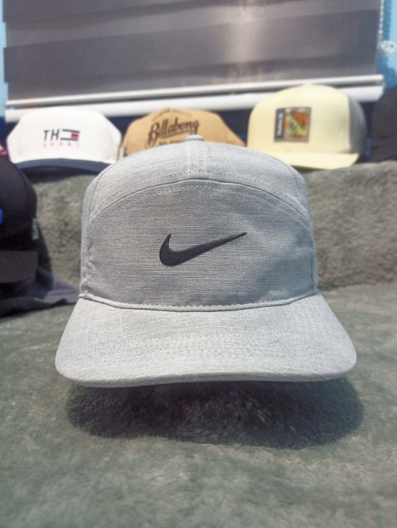 Nike Legacy 91 Dri-Fit Grey Cap (Category: Caps & Hats) located in Manila. Submitted by thecomftrift.co (Listing ID 1467026454, Image 1). Description: - Brand: Nike Legacy 91 Dri-Fit - Color: Classic Grey with embroidered black swoosh on front and back - Material/Design: Perforated sides for maximum breathability and ventilation - Fit: Fully adjustable strap closure for a custom fit - Condition: Excellent, with inner tags intact showing model and