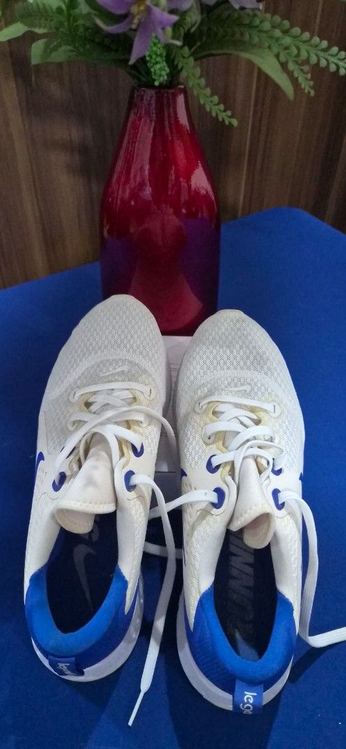 Nike Legend React Running Shoes White Blue Size US 10.5 (Category: Sneakers) located in Manila. Submitted by pixiedachi (Listing ID 1467028433, Image 1). Description: - Brand/Model: Nike Legend React (AA1625-101) - Color: White and Blue - Size: US 10.5 / UK 9.5 / EUR 44 - Upper: Breathable mesh with secure lace-up closure - Sole: Cushioned midsole for maximum comfort - Ideal for: Daily runs, gym workouts, and casual wear.