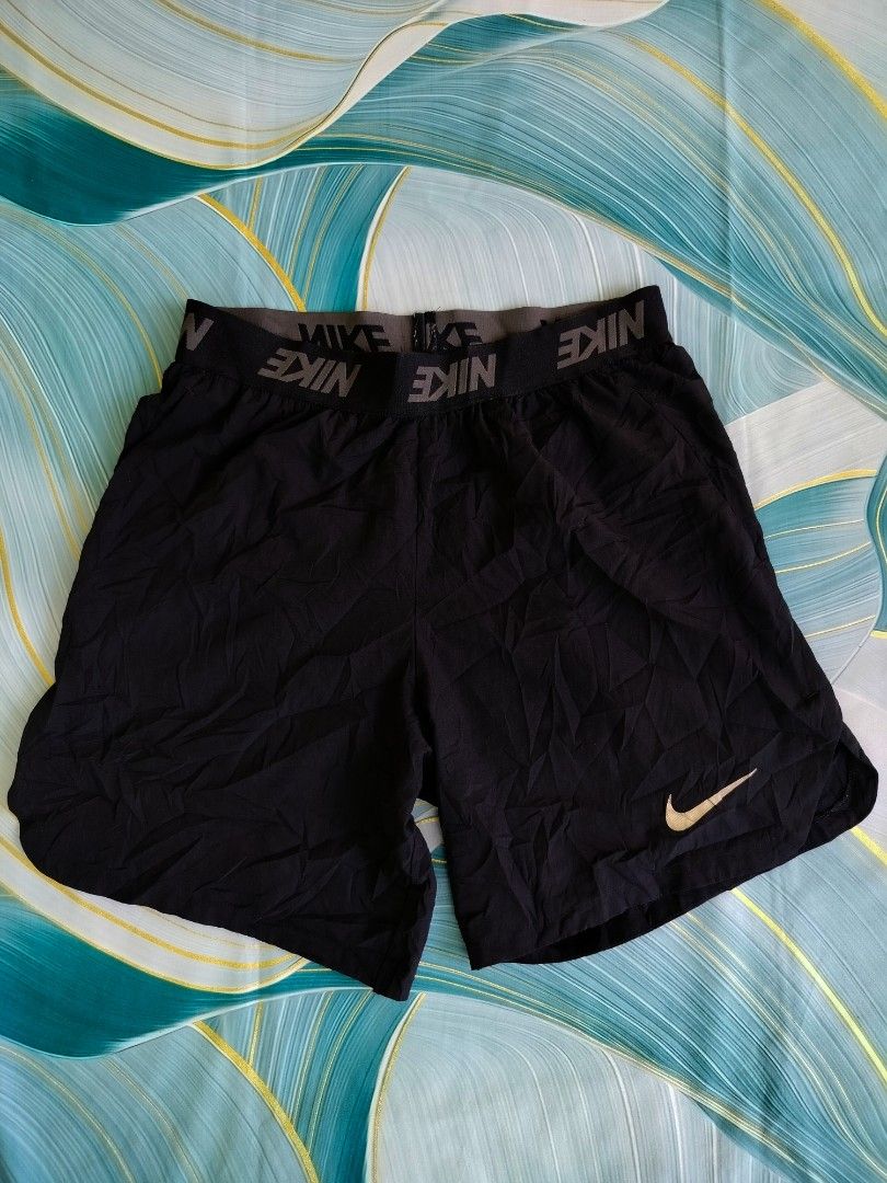 Nike Men's Black Athletic Shorts Size S (Category: Shorts) located in Manila. Submitted by virgiliosa38485 (Listing ID 1467110516, Image 2). Description: - Brand: Nike -Waist 28-38 -Length 17 -Leg Opening 13 - Color: Black with Gold Swoosh logo on lower leg - Size: Small (S) / Style Code: 886372-010 - Material: Lightweight and breathable, ideal for workouts, running, or casual wear - Features: Comfortable branded elastic waistband.