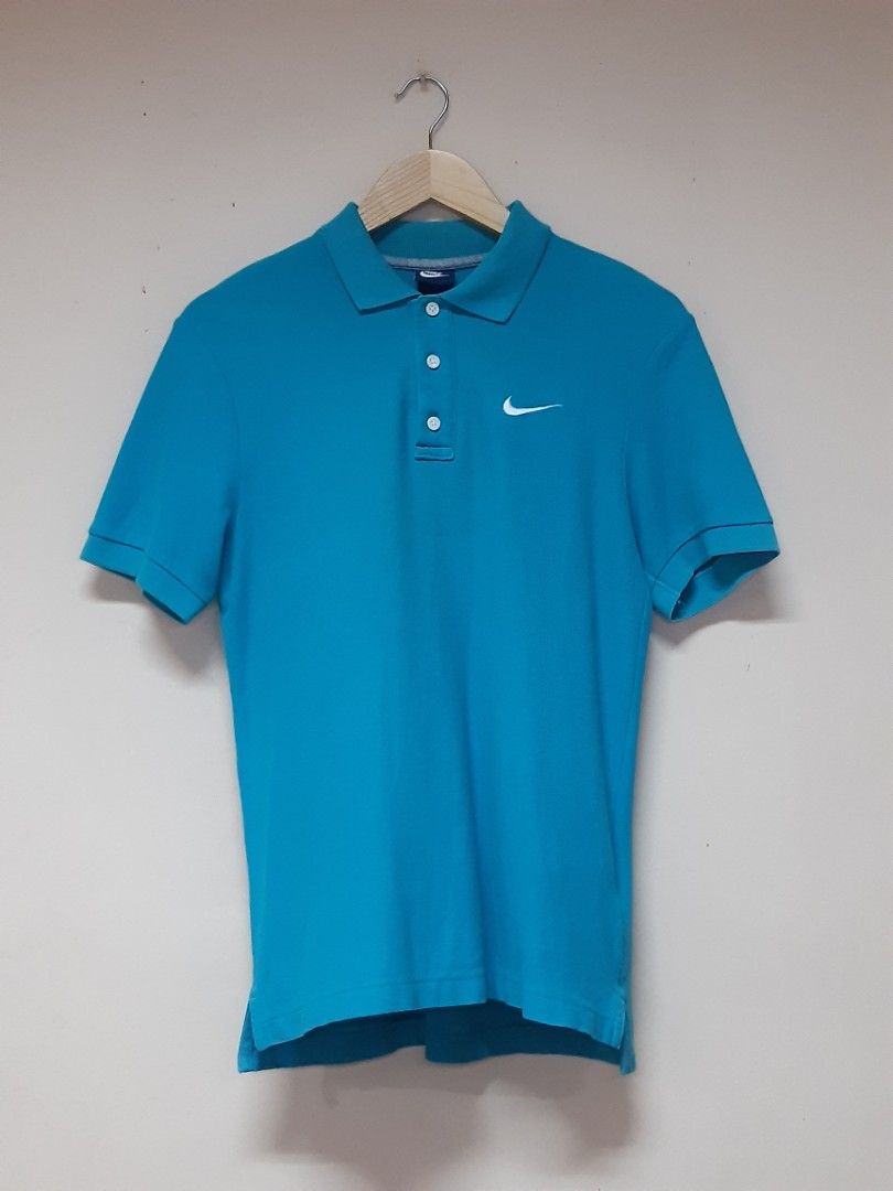 Nike poloshirt (Category: Tshirts & Polo Shirts ) located in Bauang. Submitted by 2ndskinz_by.irie (Listing ID 1467076935, Image 1). Description: nike poloshirt in cyan/turquoise colorway size: medium measurements- length: 27" width: 17.5" good condition no issues/complete tags embroid swoosh chest logo 550 +sf shipping via jnt express la union 📍 DM 📩.