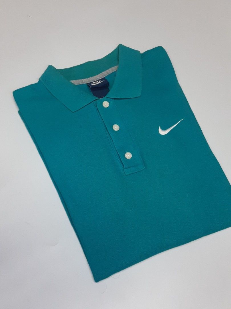 Nike poloshirt (Category: Tshirts & Polo Shirts ) located in Bauang. Submitted by 2ndskinz_by.irie (Listing ID 1467076935, Image 2). Description: nike poloshirt in cyan/turquoise colorway size: medium measurements- length: 27" width: 17.5" good condition no issues/complete tags embroid swoosh chest logo 550 +sf shipping via jnt express la union 📍 DM 📩.