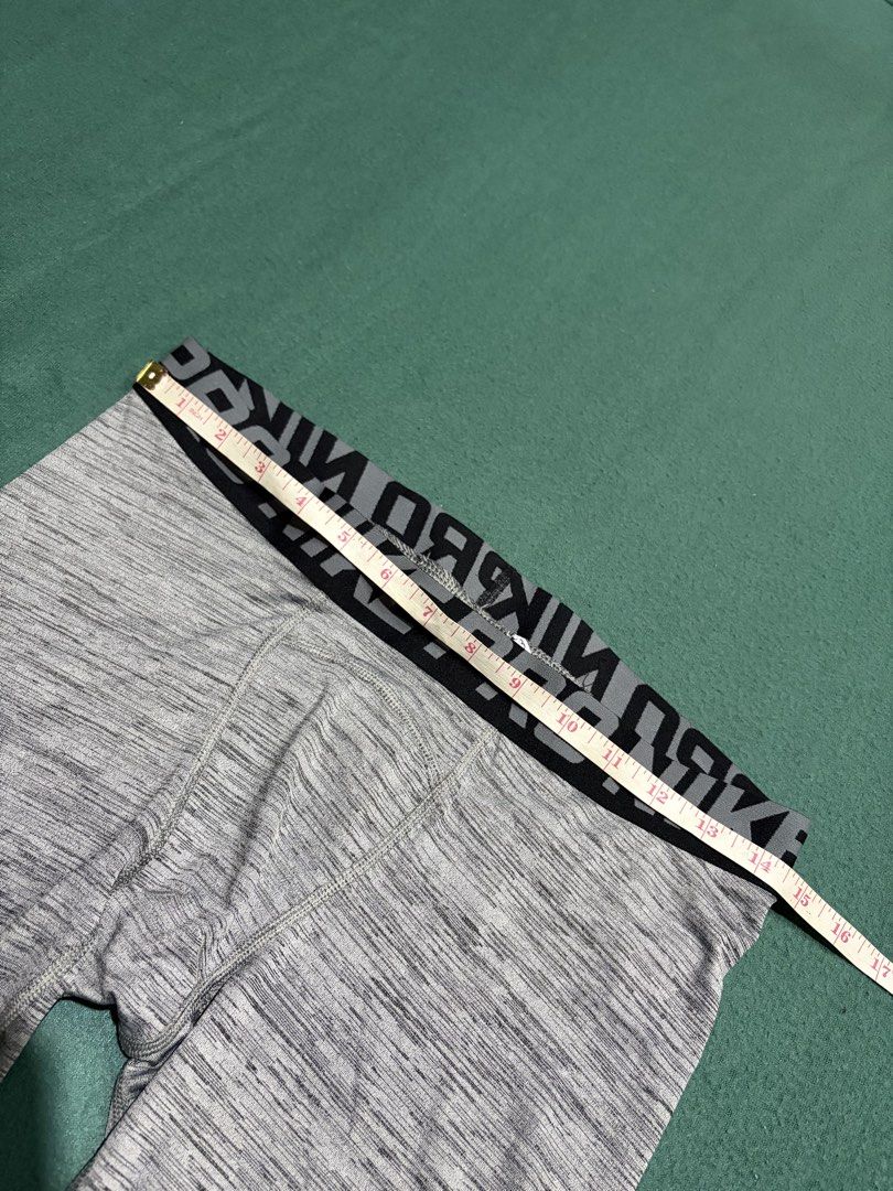 Nike Pro Dri-FIT Compression Grey Heather Leggings (Category: Activewear) located in Guihulngan. Submitted by fbthriftgoodsniace (Listing ID 1467090439, Image 3). Description: Nike Pro compression leggings in a grey heather colorway. Dri-FIT technology helps keep you dry and comfortable during workouts. Branded elastic waistband, iconic swoosh logo near the left knee. Size L tag printed on the inside. Durable fabric with reinforced stitching arou