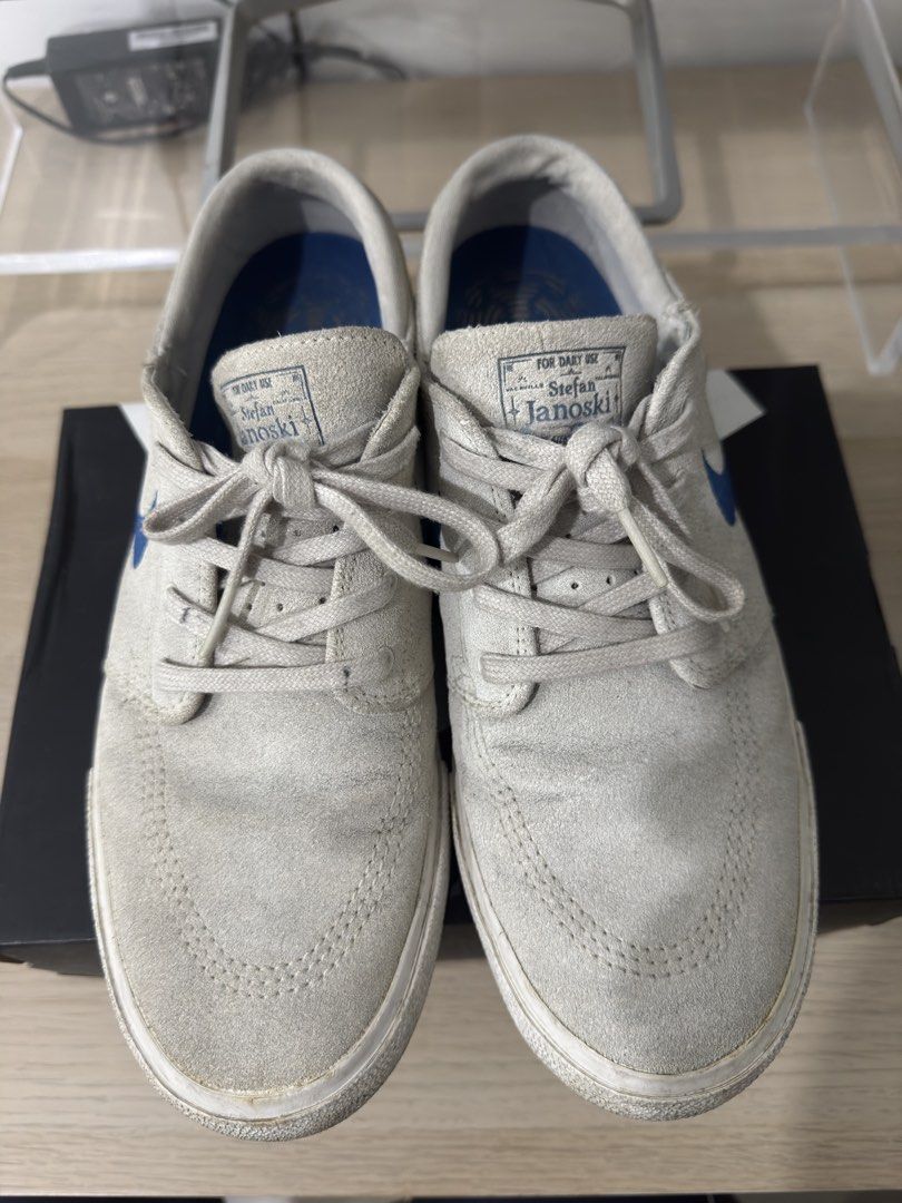Nike SB Stefan Janoski Grey Blue (Category: Sneakers) located in Caloocan City. Submitted by leandroroman (Listing ID 1467130231, Image 2). Description: - Brand: Nike SB Stefan Janoski - Color: Light grey suede with blue embroidered swoosh - Sole: Classic white rubber midsole with intact blue branded insoles - Condition: Pre-owned with minor scuffs and dirt marks from general wear; still plenty of life left for skating or daily casual use - Inclu
