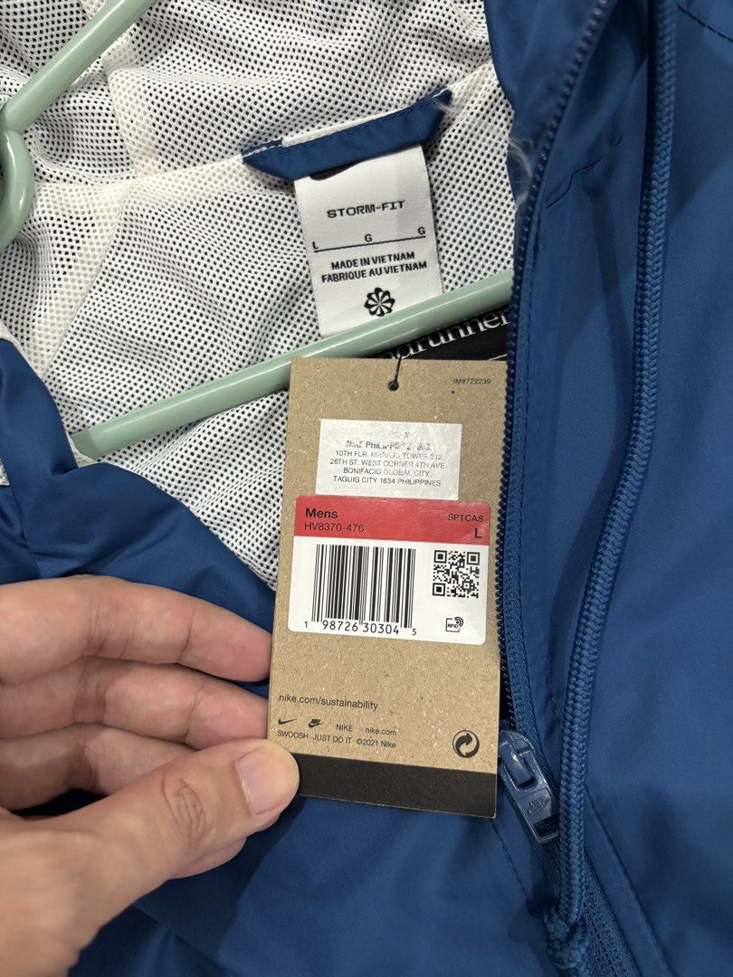Nike Storm-FIT Windrunner Jacket Blue White Size L (Category: Coats, Jackets and Outerwear) located in Bacoor. Submitted by makibao24 (Listing ID 1467068287, Image 3). Description: - Brand: Nike Storm-FIT Windrunner jacket - Color: Blue and White - Size: Men's Large (Style Code: HV8370-476) - Condition: Brand new with original tags attached - Features: Loose fit, full zip closure, hood, zippered pockets, and inner mesh lining Brandnew Size Large 