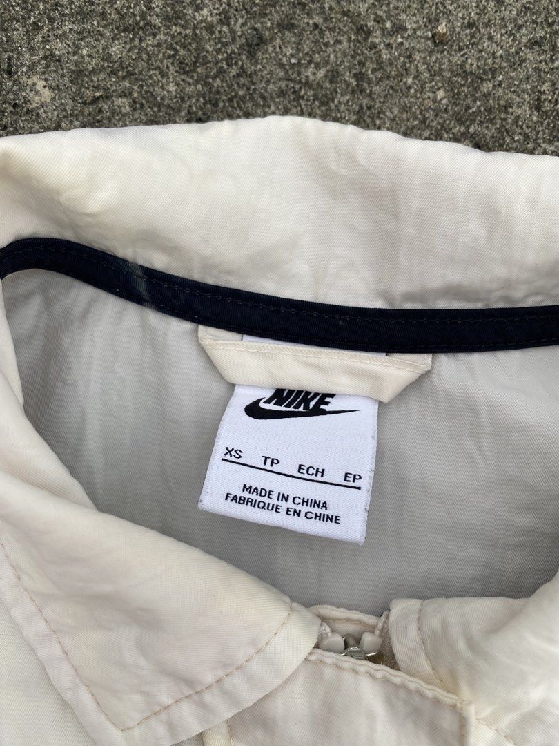 Nike Swooshwear White Button-Up Jacket (Category: Coats, Jackets and Outerwear) located in Manila. Submitted by fastturtle.4c6bfd (Listing ID 1466982597, Image 2). Description: Nike Woven Jacket 22.24.5 Excellent Condition 550.