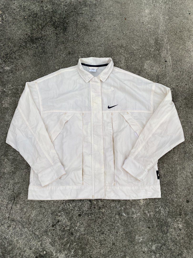 Nike Swooshwear White Button-Up Jacket (Category: Coats, Jackets and Outerwear) located in Manila. Submitted by fastturtle.4c6bfd (Listing ID 1466982597, Image 1). Description: Nike Woven Jacket 22.24.5 Excellent Condition 550.