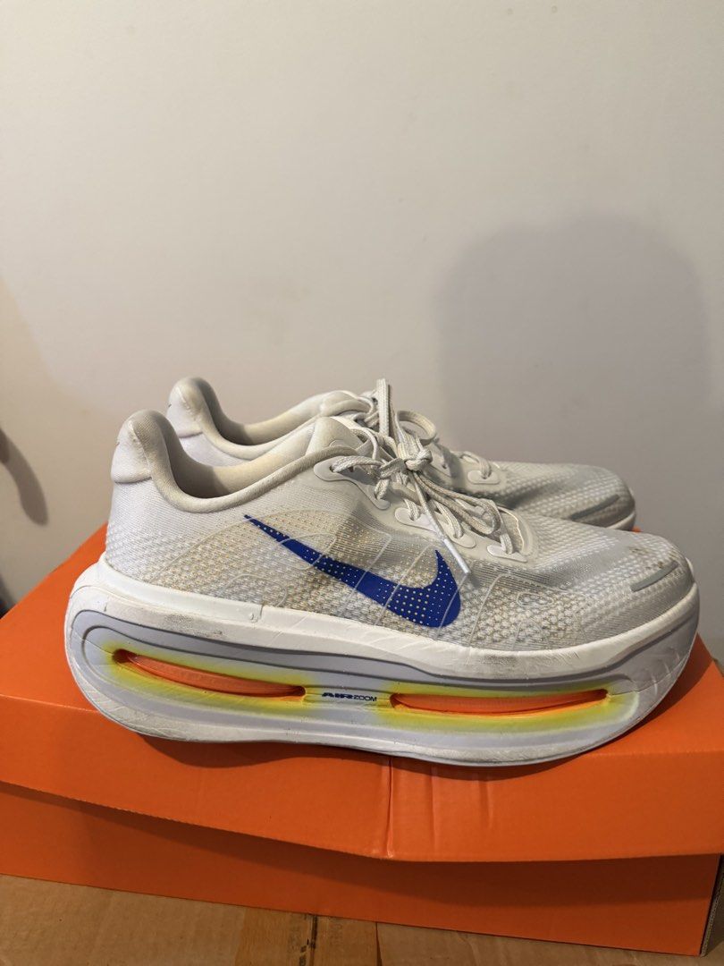 Nike Vomero Premium (Category: Sneakers) located in Taguig. Submitted by psdr24 (Listing ID 1467091597, Image 3). Description: - Model: nike vomero premium US 9 men’s - Colorway: White upper with blue Swoosh and vibrant orange accents - Inclusion: Comes with the original orange box - Perfect for: easy and long runs .