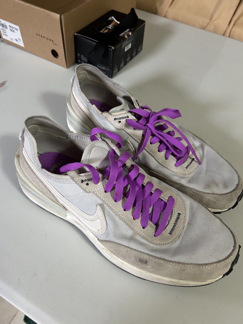 Nike Waffle One SE Nike Moving Co. Size 10 (Category: Sneakers) located in Taytay. Submitted by teddyy08 (Listing ID 1467104062, Image 1). Description: - Brand/Model: Nike Waffle One SE - Colorway: Light grey and white with vibrant purple laces - Special Detail: Nike Moving Co. snail graphic printed on the purple insole - Materials: Suede overlays and textile mesh panels - Size: US 10 / UK 9 / EUR 44 - Condition: Worn thrice with minor dirt marks