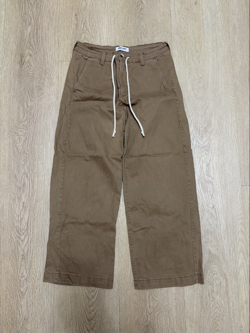 Nine West Brown Drawstring Wide Leg Pants (Category: Jeans) located in Makati City. Submitted by sbllia (Listing ID 1467110090, Image 1). Description: - Brand: Nine West - Color: Brown (earthy tone) - Style: Wide leg cut - Waistline: Adjustable white drawstring with standard belt loops - Pockets: 2 front slip pockets and 2 back mock welt pockets - Material: Sturdy woven fabric.