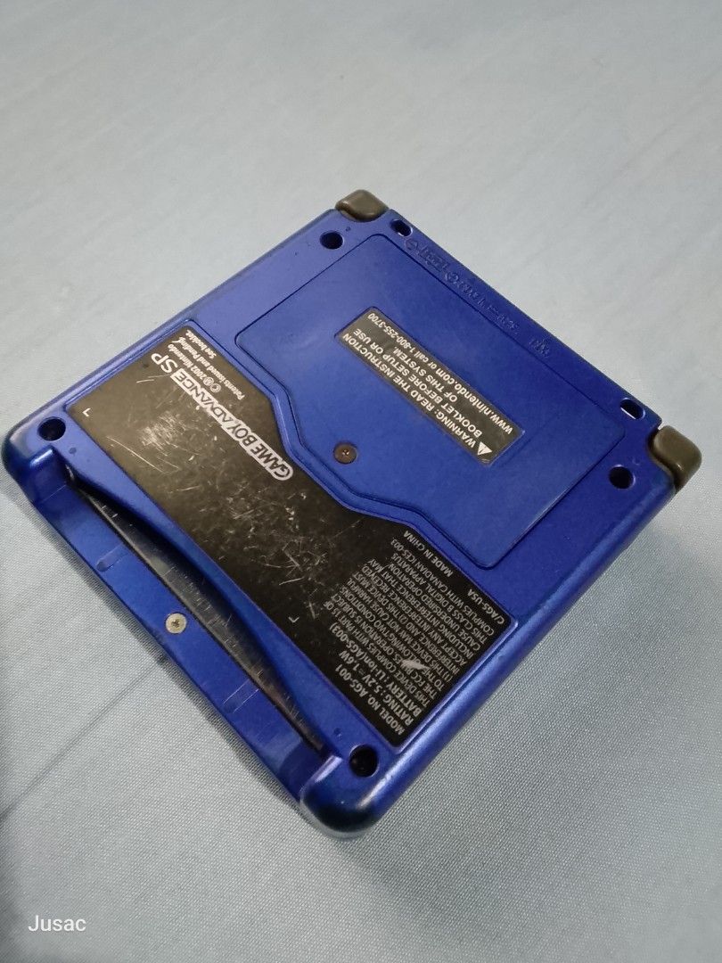 Nintendo Game Boy Advance SP Blue Handheld Console (Category: Nintendo) located in San Felipe. Submitted by jusac_19 (Listing ID 1467079636, Image 3). Description: - Authentic Nintendo Game Boy Advance SP in dark blue - Fully tested and 100% functional with v4 ips screen - Normal cosmetic wear: scuffs and stains on outer casing, plus scratches on bottom label - Clean battery compartment - Ready for your favorite retro games!.